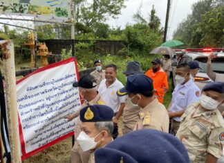Law enforcement officers give owners 15 days to demolish structures encroaching on beach in Thalang