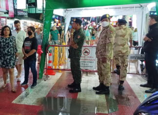 Female beer vendor on Bangla Road takes off her clothes in protest after being warned for illegally selling alcohol