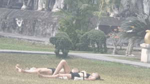 Foreign Tourists Sunbathing on Chiang Mai Temple Premises Spark Outrage Among Local Residents