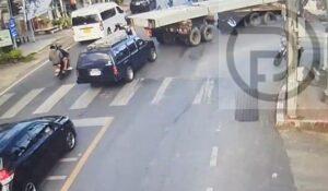 Thai Police Warn Motorbike Riders Driving Under Trailer Truck in Thalang – Video