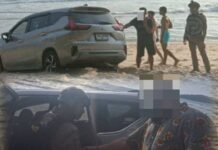 Toerist beboet voor het rijden met auto op strand van Phuket